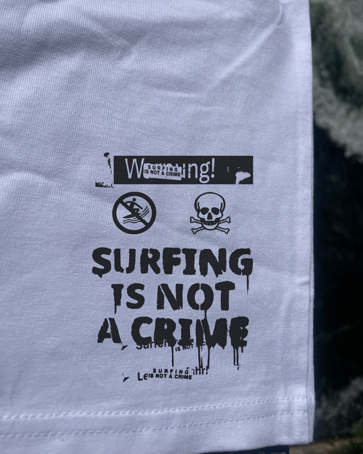 Surfing Is Not a Crime Big Logo T-Shirt — back print detail
